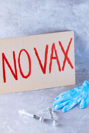 No vax concept. Anti vaccination protestive placard. Coronavirus Anti Vax controversy conceptの写真素材