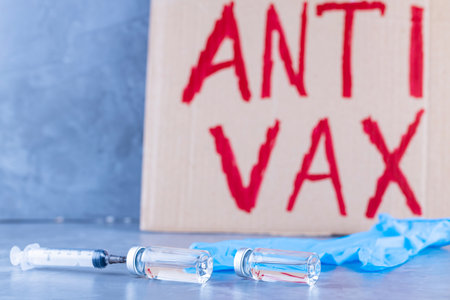 'Anti vax' protestive placard. Stop vaccination concept. Coronavirus Anti Vax controversy conceptの写真素材