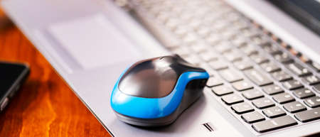 Remote work graphic designer. Freelancer workplace. Laptop, smartphone and graphic tablet in the workplaceの写真素材