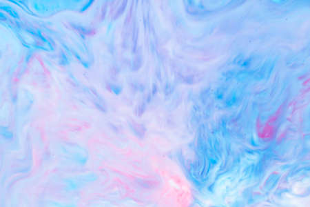 Fluid Art. Abstract liquid paint textured background with decorative spirals and swirls. Liquid pink blue backdrop. Trendy wallpaperの写真素材