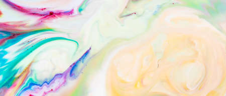 Multicolored lines and spots on liquid surface. Abstract background made with fluid art technique. Trendy colorful backdrop. Fluid artの写真素材