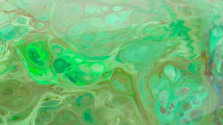 Psychedelic fluid art background. Multicolored stains on a liquid surface. Creative background with...