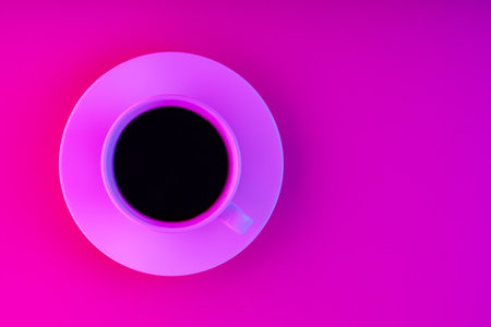 Cup of coffee and saucer in pink neon light. Coffee on a creative pink background. top view. copy...