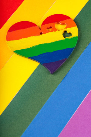 Rainbow heart on LGBT Pride flag. LGBT rights, Pride month, tolerance and love concept. copy spaceの写真素材