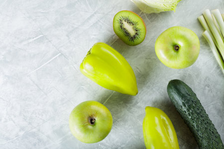 Fresh Organic Green Fruits and Vegetables on Gray Background, Copy Spaceの写真素材