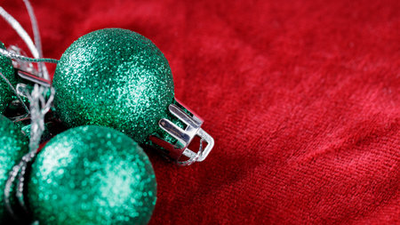 Green Christmas Balls on Red Background, Seasonal Holiday Decoration, Copy Spaceの写真素材