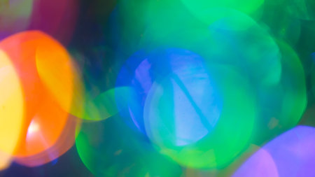 Multicolored Festive Background with Vibrant Gradient and Cheerful Bokeh Lightsの写真素材