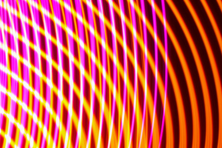 Flowing Curved Light Lines Orange and Yellow Abstract Backgroundの写真素材