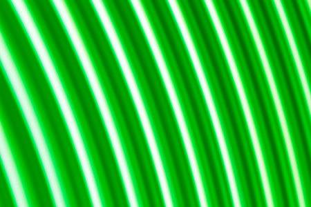 Curved Green and White Light Wave Abstract Backgroundの写真素材
