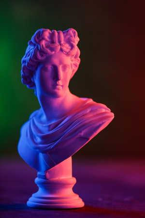 Plaster Head with Pink Blue Neon Contrast on Dark Background