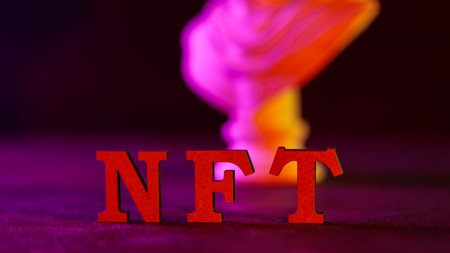 Red NFT Letters with Purple Pink Orange Neon Smoke Effect Dark Backgroundの写真素材