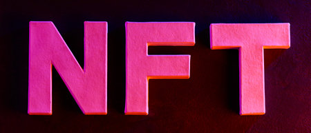 Bold pink NFT letters with neon glow effect on dark background for crypto art concept