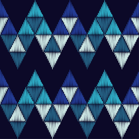 Seamless abstract geometric pattern. The texture of the triangles. Embroidery on fabric. Brushwork. Hand hatching. Scribble texture. Textile rapport.のイラスト素材