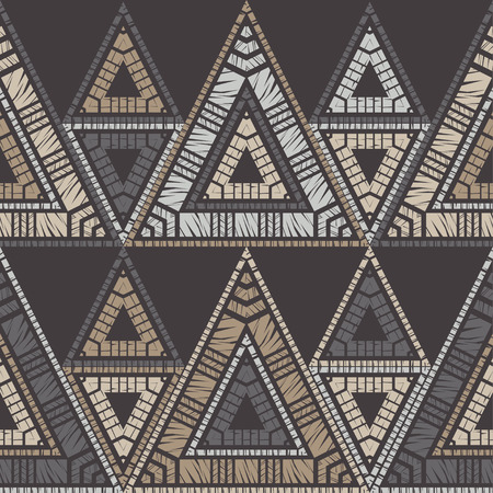 Ethnic boho seamless pattern. Triangles. Embroidery on fabric. Patchwork texture. Weaving. Traditional ornament. Tribal pattern. Folk motif. Can be used for wallpaper, textile, wrapping, web page background.のイラスト素材