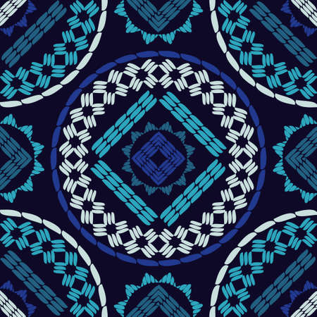 Embroidery. A mosaic of striped geometric figures. Seamless pattern. Design with manual hatching....