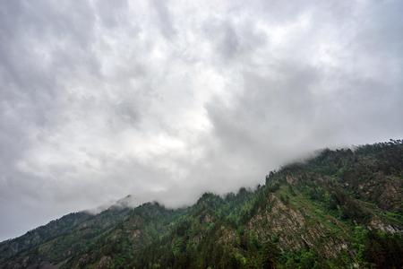 Rainy clouds stuck in the mountains