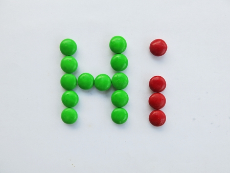 the word \"Hi\" made by chocolate mm candyの写真素材