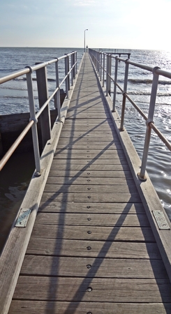 Wooden bridge over the seaの写真素材