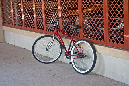 beach cruiser style bike locked up at parking garage