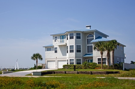 pastel blue coastal living home in Florida on the waterの写真素材