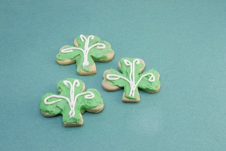 three St. Patricks themed iced sugar cookiesの写真素材