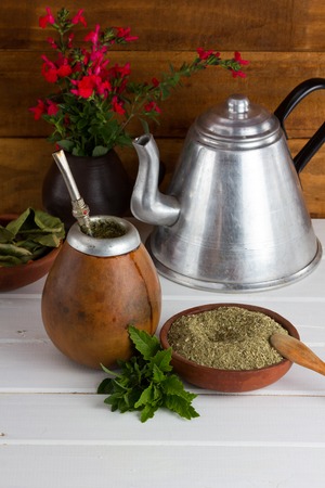 Yerba mate traditional tea popular in latin america sirved on the wooden selective focusの写真素材