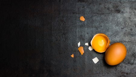 Chicken eggs on black background. Top viewの写真素材