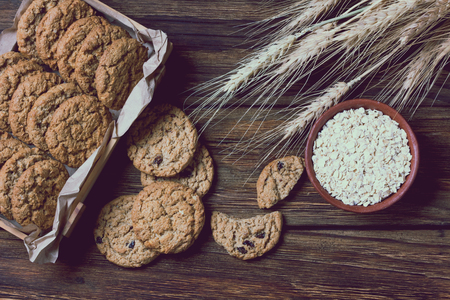 Oatmeal cookies on wooden background in rustic style. Top viewの写真素材