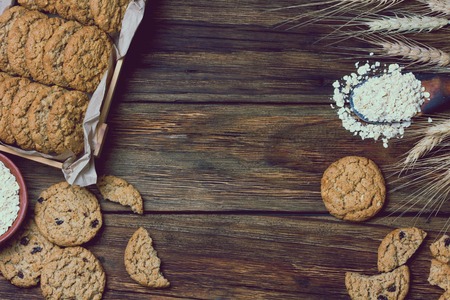 Oatmeal cookies on wooden background in rustic style. Copy space. Top viewの写真素材