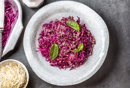 Cabbage salad with soybean sprouts and edible garlic flowersの写真素材
