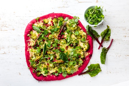 Purple beetroot dough, vegetables and sprouis pizza, Healthy fast food