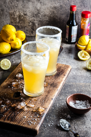 Drink Michelada chilena. Traditional Latin American chilean mexican refreshing beer drink with lemon, salt and iceの写真素材