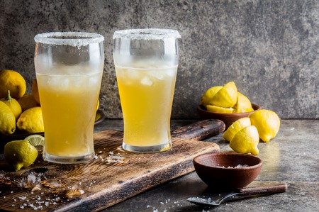 Drink Michelada chilena. Traditional Latin American chilean mexican refreshing beer drink with lemon, salt and ice, copy spaceの写真素材