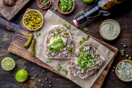 Raw meat sandwiches. CRUDO VALDIVIANO. tipical chilean food from region Valdivia. Chilean food, aleman food. Tartar sandwiches.の写真素材
