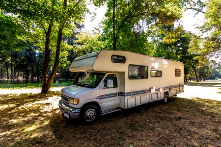 Family trip in motorhome in forest or park in South Chileの写真素材
