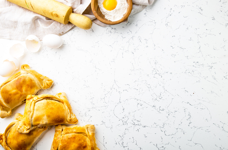 Chilean EMPANADAS DE PINO. Independence day baking concept. Empanadas on white background.の写真素材