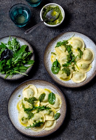 Italian spinach ricotta ravioli, Top view, black background, copy space, Vegetarian food, vegan ravioliの写真素材