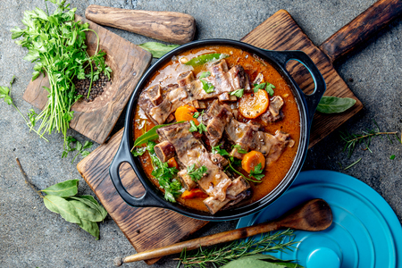 Bourguignon beef ribs stewed with onion, carrot in red wine. Top viewの写真素材