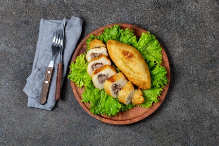 PERUVIAN CHILEAN traditional dish PAPA RELLENA meat stuffed mashed potato on wooden plate.