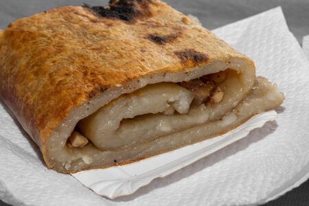 Traditional potato bread CHOCHOCA from Chiloe Island Chile prepared on wooden stickの写真素材