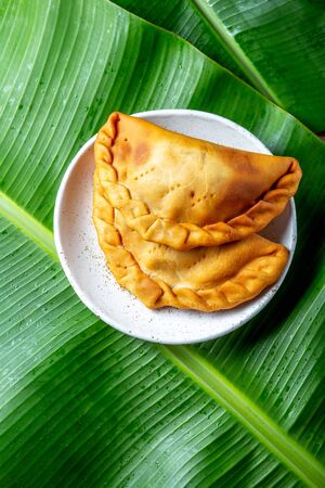 Easter Island Tuna empanadas on banana palm tree leaves. Top view.の写真素材