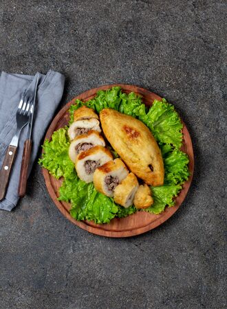 PERUVIAN CHILEAN traditional dish PAPA RELLENA meat stuffed mashed potato on wooden plate.の写真素材