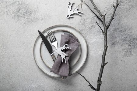 Cristmas table cutlery set with holiday decoration. Top view, copy space.