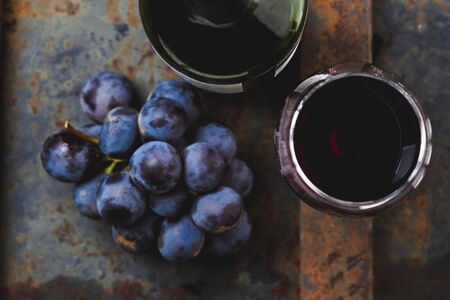 Wine concept - wine, grape on rustik dark background. top viewの写真素材