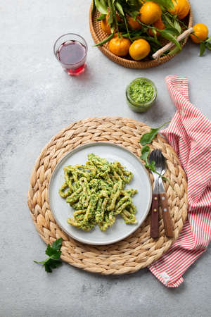 Pasta Lorighittas of Sardinia. Loriguittas with herb sauce pesto. in White plate.の写真素材