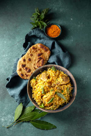 Pakistani and Indian chicken Biryani rice with mint and naa breadの写真素材