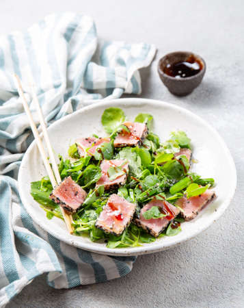 Japanese sliced grilled tuna steak salad with sesame and suace. Close upの写真素材
