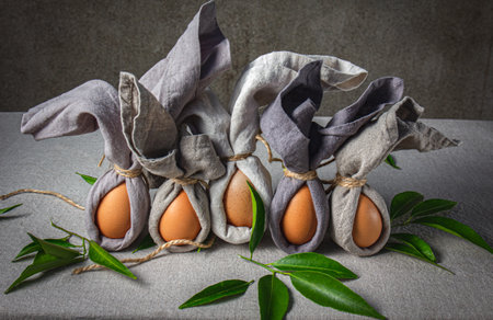 Easter background with Easter bunny made from eggs and linen napkin. Festive easter home table decorationter home table decorationの写真素材