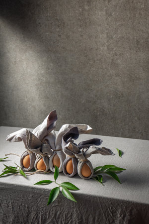 Easter background with Easter bunny made from eggs and linen napkin. Festive easter home table decorationter home table decorationの写真素材