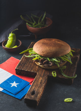Chilean Latin american sandwich burger Chacarero with premium beef slices and green bean on black backgroundの写真素材